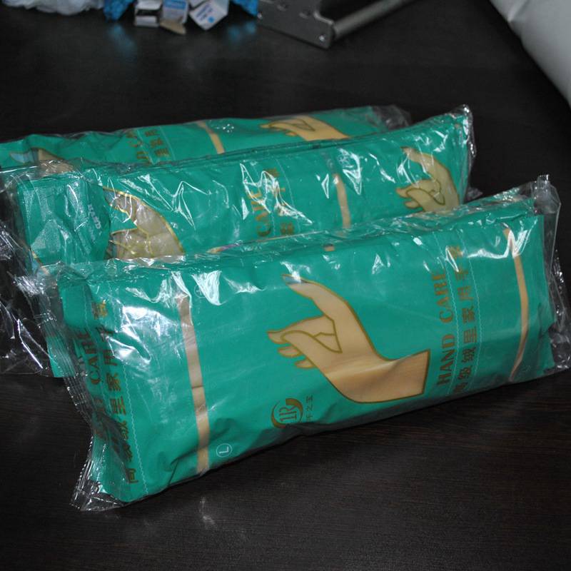 手套枕式包裝機棉紗手套包裝機可全自動點數下料賽諾廠家